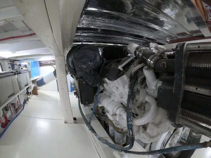  Yacht Photos Pics Engine room of 2005 Custom Carolina C 30 CAT boat, showcasing mechanical components.