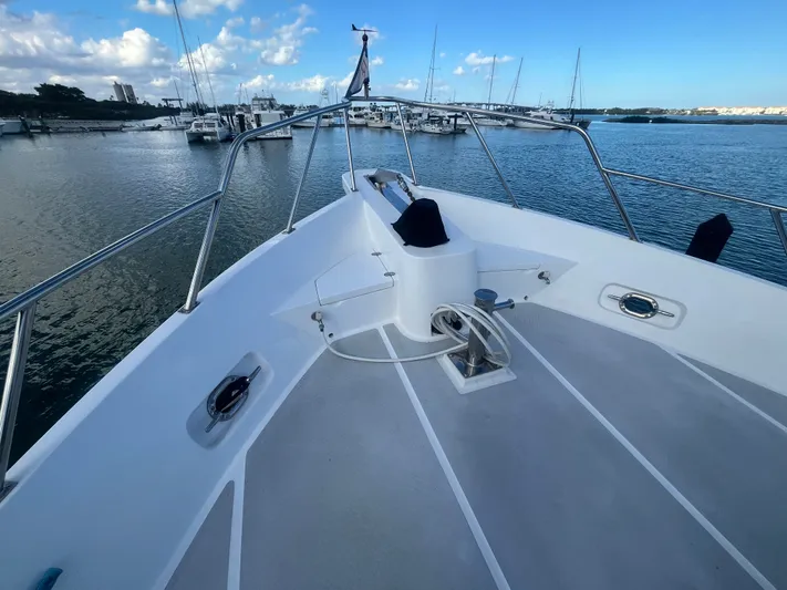 September Song Yacht Photos Pics DeFever 55 Yacht 2007 in harbor with clear sky.