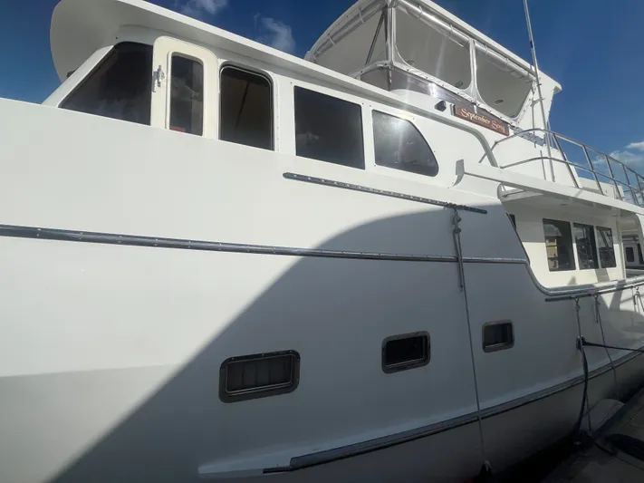 September Song Yacht Photos Pics 2007 DeFever 55 yacht, side view at dock.
