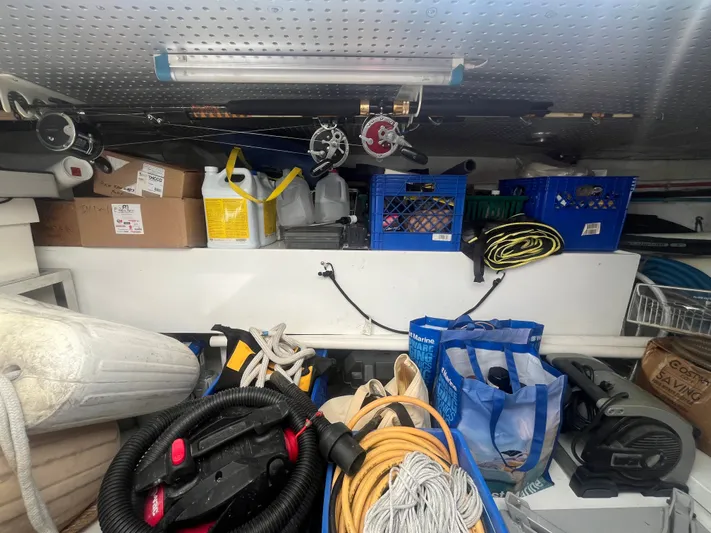 September Song Yacht Photos Pics Storage area on DeFever 55 yacht with fishing gear and supplies.