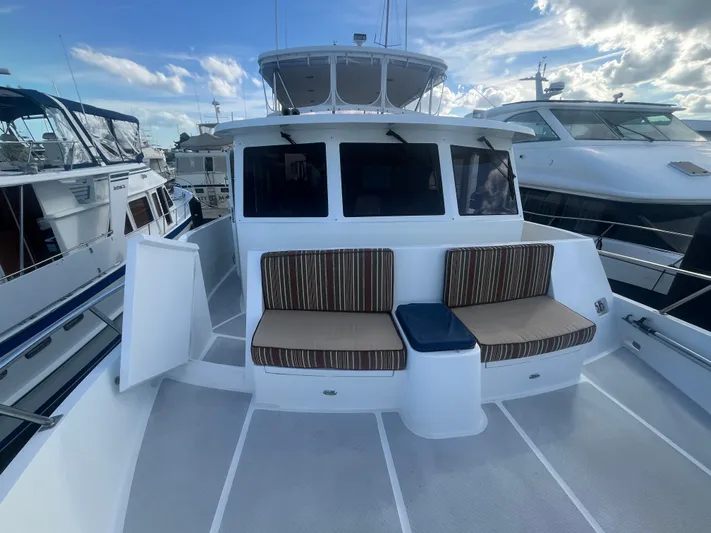 September Song Yacht Photos Pics 2007 DeFever 55 yacht with deck seating area.