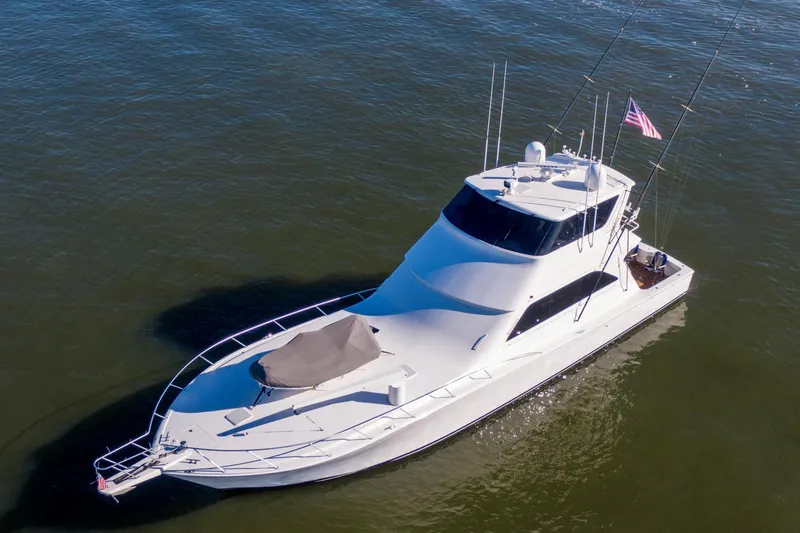 Prime Time Yacht Photos Pics 2002 Viking 65 Enclosed Bridge yacht on calm water, aerial view.