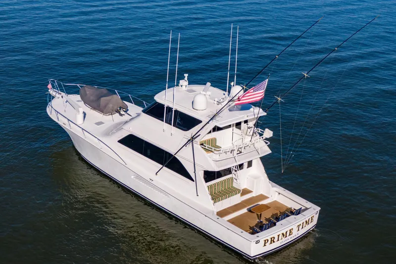 Prime Time Yacht Photos Pics 2002 Viking 65 Enclosed Bridge yacht on open water, aerial view.