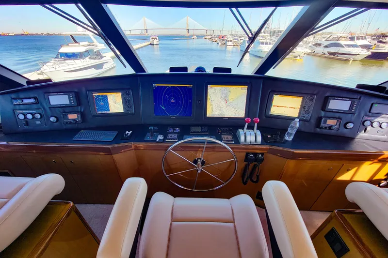 Prime Time Yacht Photos Pics Interior view of 2002 Viking 65 Enclosed Bridge yacht helm with navigation equipment.