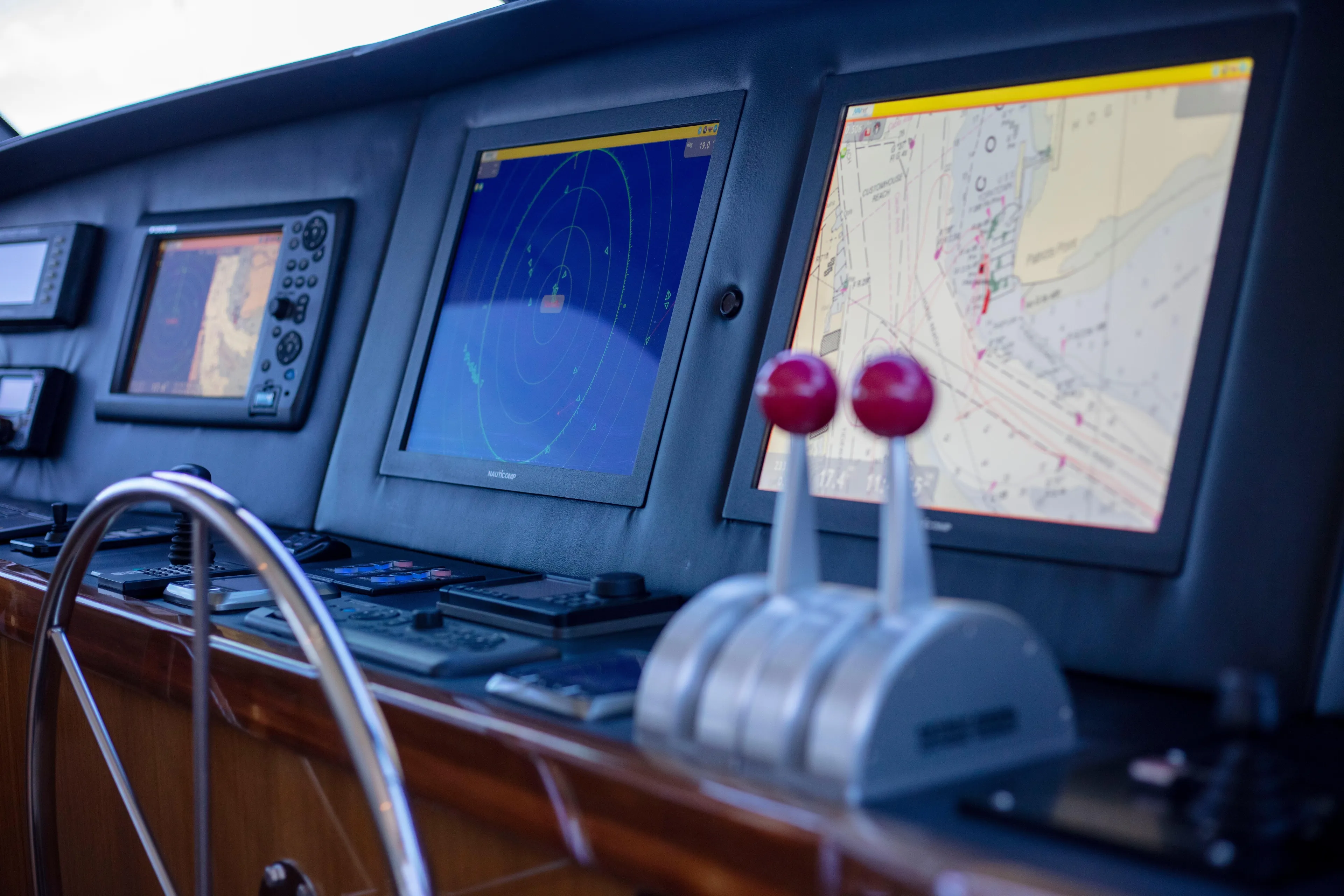 Prime Time Yacht Photos Pics Control panel of 2002 Viking 65 Enclosed Bridge yacht with navigation screens.