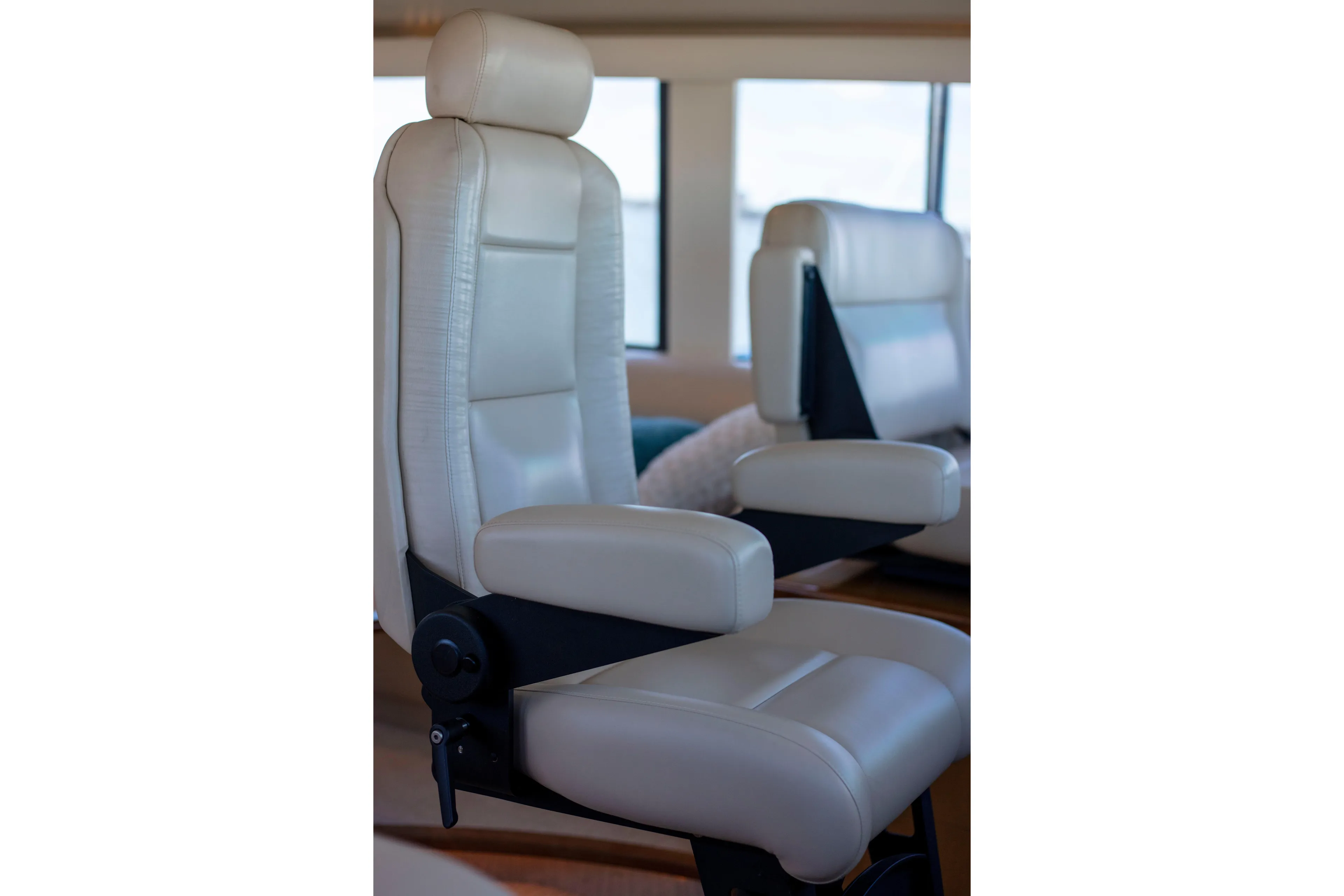 Prime Time Yacht Photos Pics Luxurious white leather seating inside a 2002 Viking 65 Enclosed Bridge yacht.