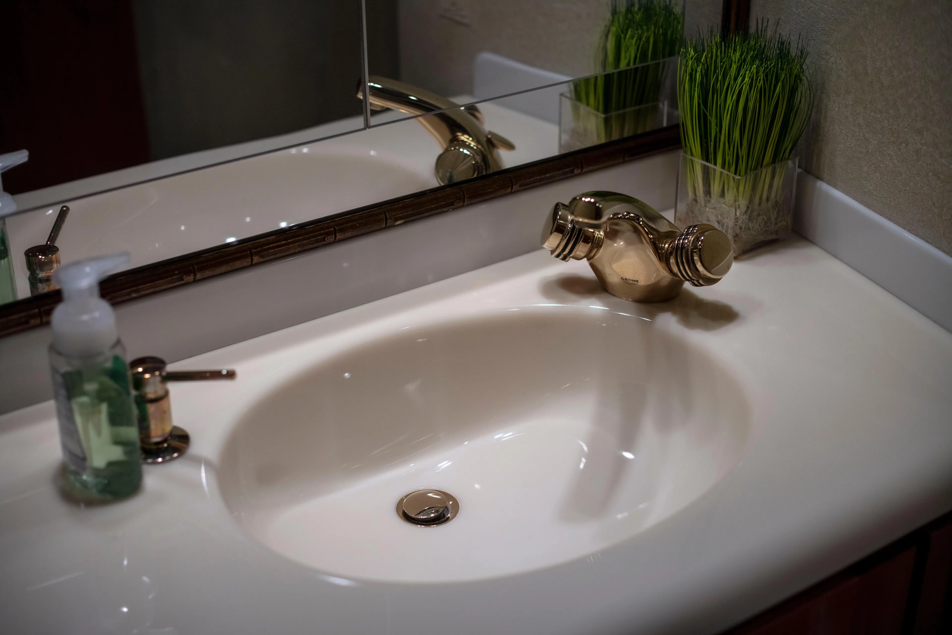 Prime Time Yacht Photos Pics Elegant bathroom sink with gold faucet on 2002 Viking 65 Enclosed Bridge yacht.