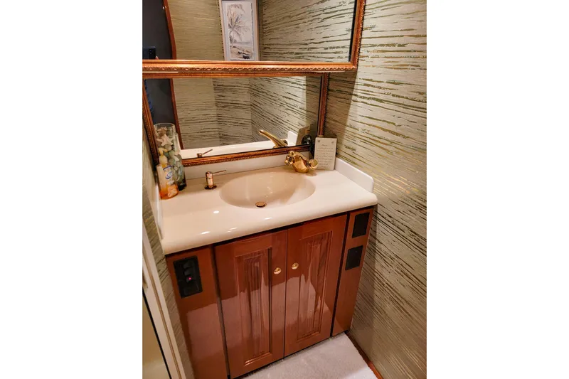 Prime Time Yacht Photos Pics Luxurious bathroom vanity on 2002 Viking 65 Enclosed Bridge yacht.