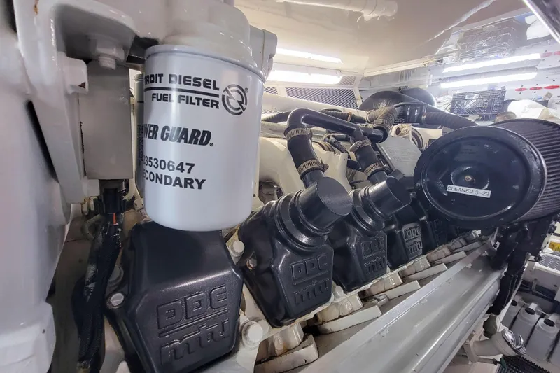 Prime Time Yacht Photos Pics Engine room of 2002 Viking 65 Enclosed Bridge with Detroit Diesel fuel filter.