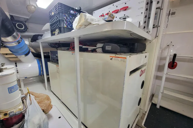 Prime Time Yacht Photos Pics Engine room of 2002 Viking 65 Enclosed Bridge yacht with Onan generator.