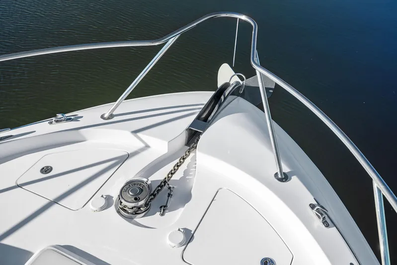 Bonefish Yacht Photos Pics 2016 Hatteras M60 yacht bow with anchor and railing.