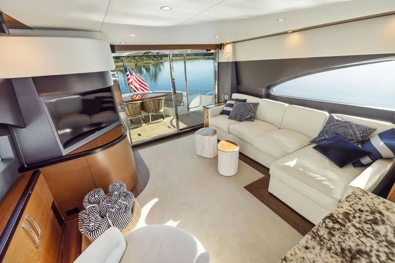 Bonefish Yacht Photos Pics Luxurious 2016 Hatteras M60 yacht interior with elegant seating and waterfront view.