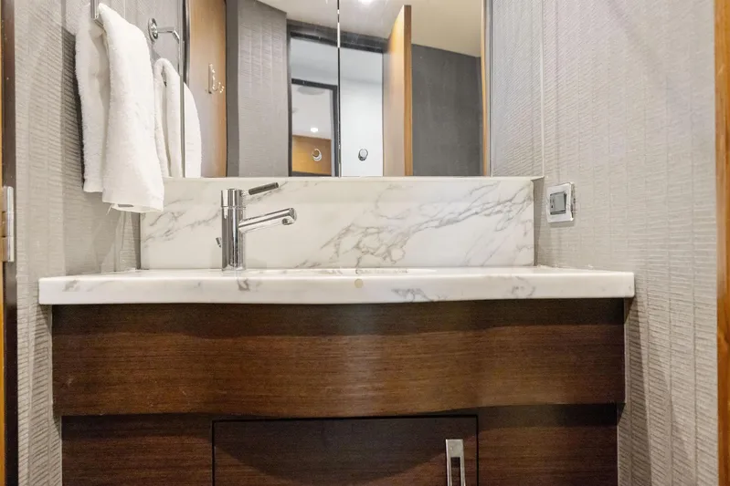 Bonefish Yacht Photos Pics Luxurious bathroom vanity in 2016 Hatteras M60 yacht with marble countertop.