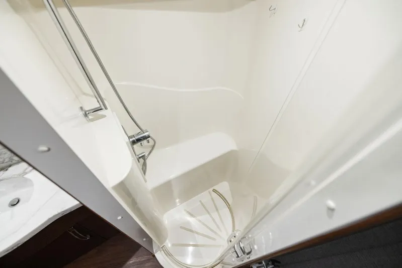 Bonefish Yacht Photos Pics Shower area in 2016 Hatteras M60 yacht, featuring sleek design and modern fixtures.
