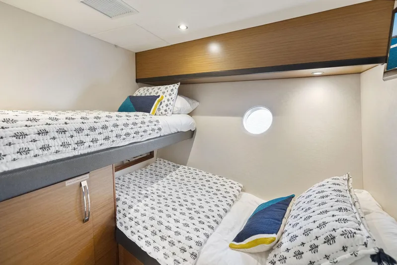 Bonefish Yacht Photos Pics Cozy cabin with twin beds in 2016 Hatteras M60 yacht.