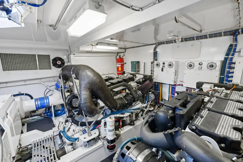 Bonefish Yacht Photos Pics Engine room of 2016 Hatteras M60 yacht, featuring advanced machinery and equipment.