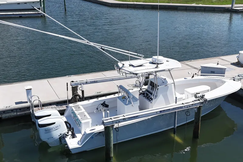 Cherokee Yacht Photos Pics 2022 Ocean Runner 29 Center Console boat docked with dual Suzuki engines.