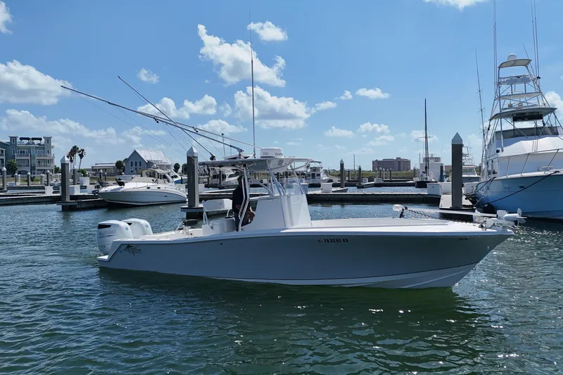 Cherokee Yacht Photos Pics 2022 Ocean Runner 29 Center Console boat docked in a sunny marina.