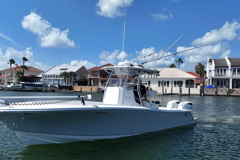Cherokee Yacht Photos Pics 2022 Ocean Runner 29 Center Console boat on water, with coastal homes in background.