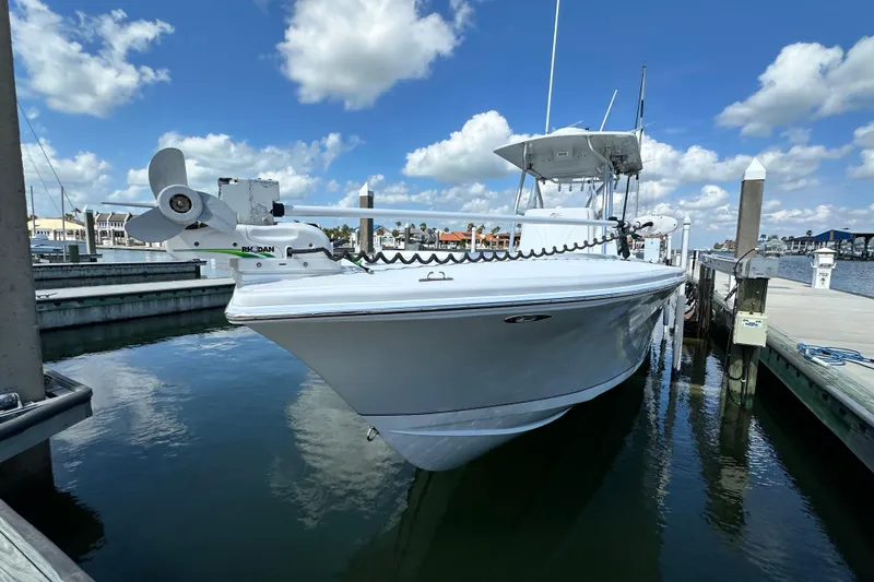 Cherokee Yacht Photos Pics 2022 Ocean Runner 29 Center Console boat docked under a blue sky.