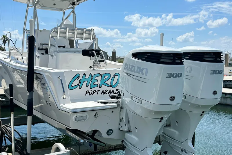 Cherokee Yacht Photos Pics 2022 Ocean Runner 29 Center Console boat with twin Suzuki 300 engines at dock.