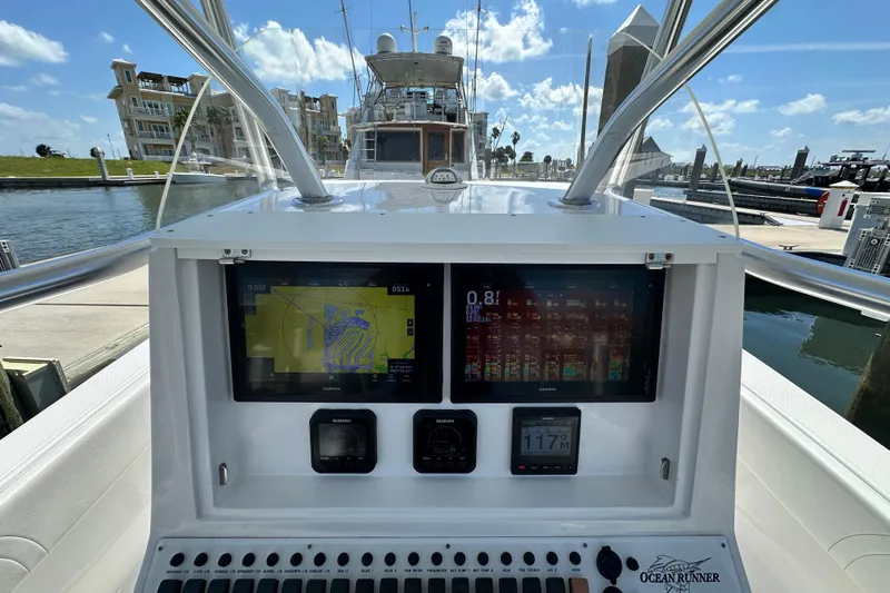 Cherokee Yacht Photos Pics 2022 Ocean Runner 29 Center Console dashboard with navigation screens and controls.