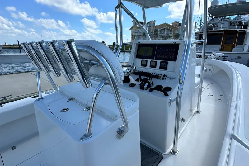 Cherokee Yacht Photos Pics 2022 Ocean Runner 29 Center Console boat with modern helm and seating, docked at marina.