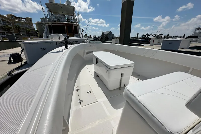 Cherokee Yacht Photos Pics 2022 Ocean Runner 29 Center Console boat docked, featuring spacious seating and storage.