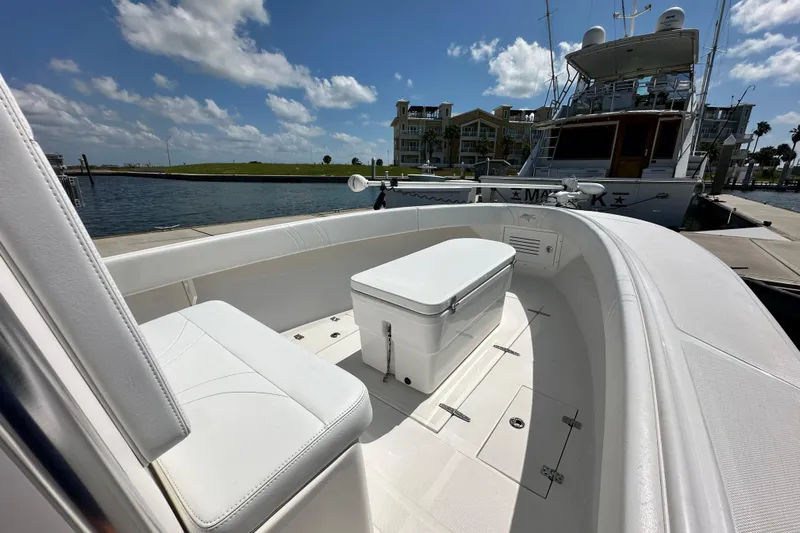 Cherokee Yacht Photos Pics 2022 Ocean Runner 29 Center Console boat docked, featuring spacious seating and storage.