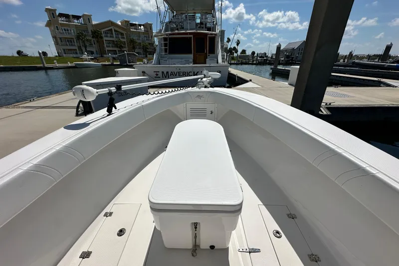 Cherokee Yacht Photos Pics 2022 Ocean Runner 29 Center Console boat docked at marina under blue sky.