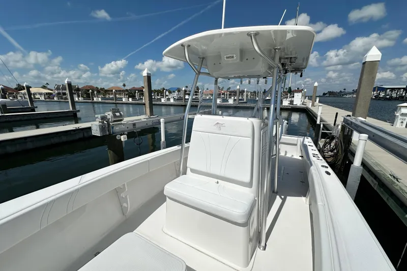 Cherokee Yacht Photos Pics 2022 Ocean Runner 29 Center Console boat docked at marina under clear blue sky.