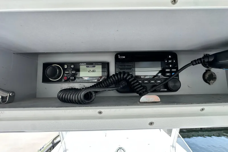 Cherokee Yacht Photos Pics 2022 Ocean Runner 29 Center Console dashboard with Fusion and Icom marine electronics.