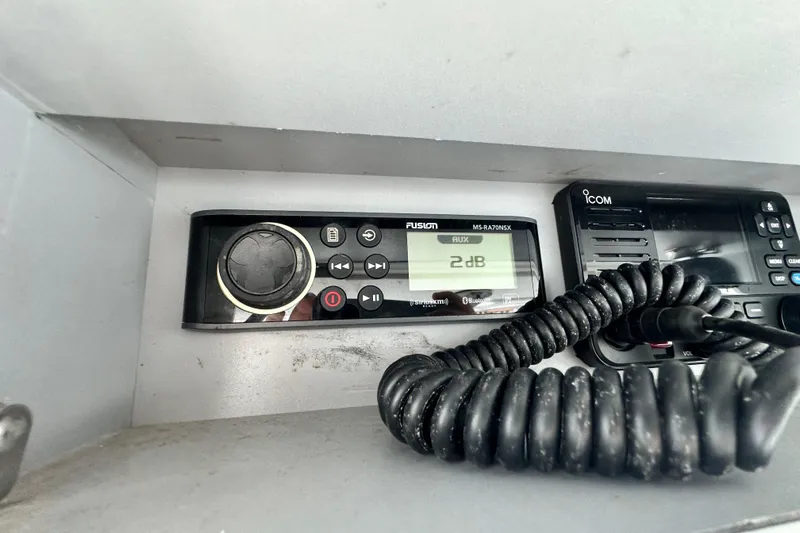 Cherokee Yacht Photos Pics Fusion and Icom marine radios on 2022 Ocean Runner 29 Center Console boat dashboard.