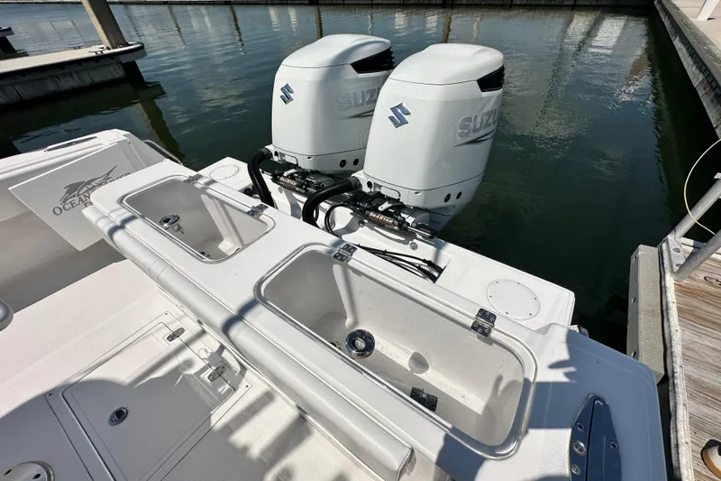 Cherokee Yacht Photos Pics 2022 Ocean Runner 29 Center Console with dual Suzuki outboard motors at dock.