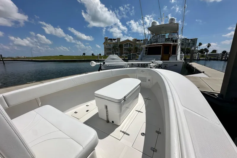 Cherokee Yacht Photos Pics 2022 Ocean Runner 29 Center Console boat docked under a clear blue sky.