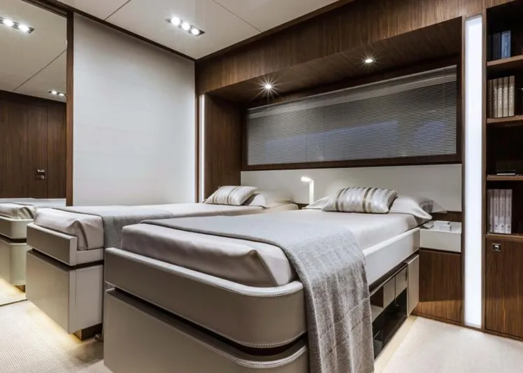  Yacht Photos Pics Luxurious cabin interior of 2017 Riva 88' Domino Super yacht with twin beds and modern decor.