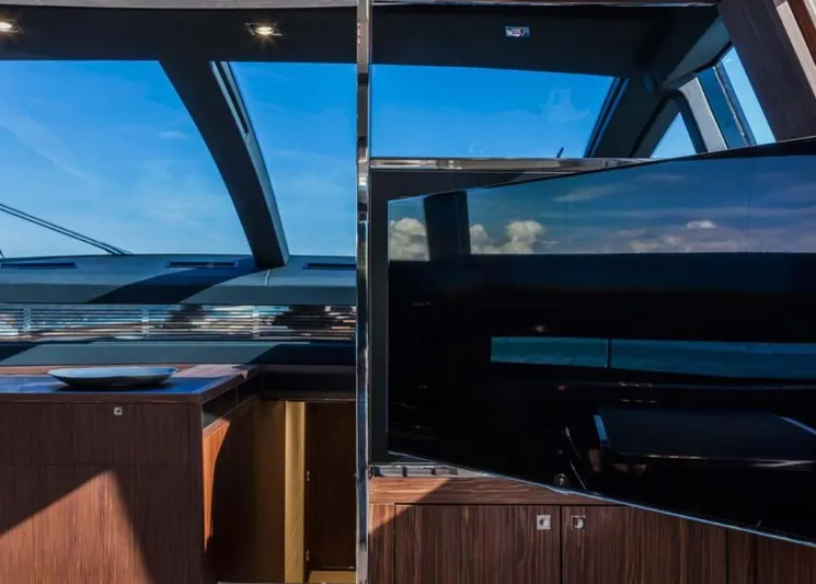  Yacht Photos Pics Luxurious interior of 2017 Riva 88' Domino Super yacht with sleek design and large windows.