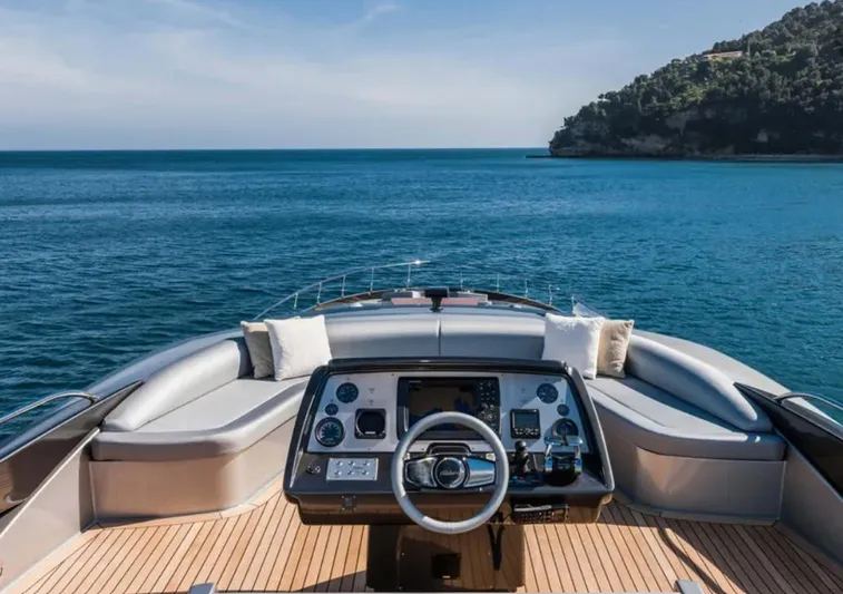  Yacht Photos Pics Luxurious 2017 Riva 88' Domino Super yacht helm with ocean view and coastal backdrop.
