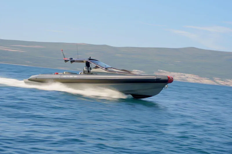  Yacht Photos Pics 2023 Anvera 48 luxury yacht cruising on open water, showcasing sleek design and speed.