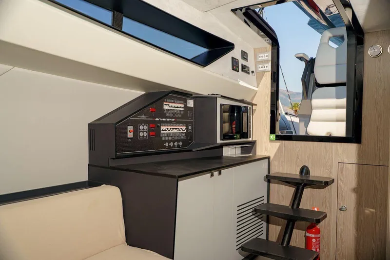  Yacht Photos Pics Interior of 2023 Anvera 48 yacht featuring control panel and modern seating.
