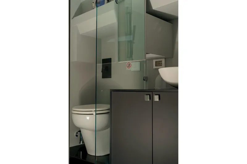  Yacht Photos Pics Modern bathroom interior on 2023 Anvera 48 yacht, featuring sleek design and glass elements.