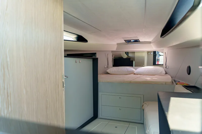  Yacht Photos Pics Luxurious interior of 2023 Anvera 48 yacht featuring a cozy bedroom with modern design.