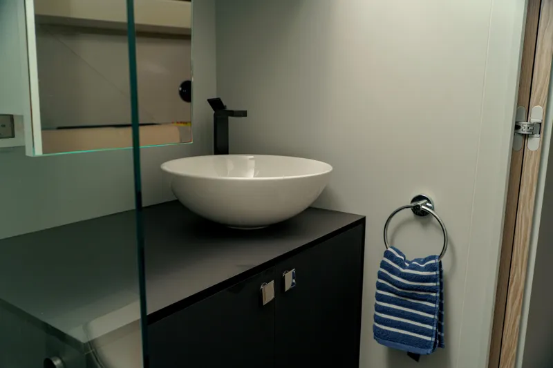  Yacht Photos Pics Modern bathroom sink with striped towel in 2023 Anvera 48 yacht.