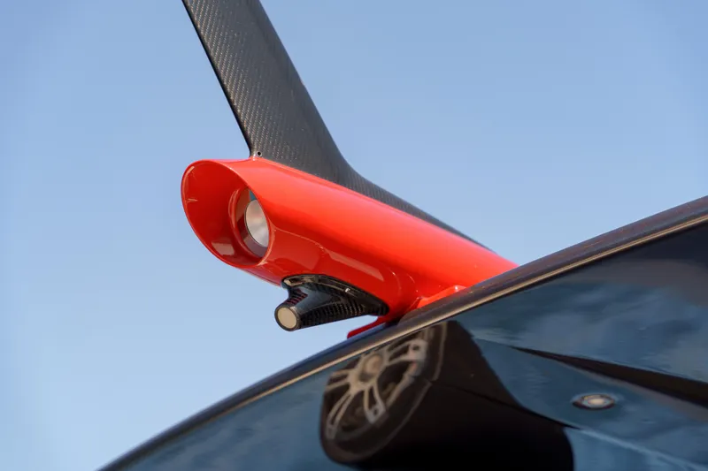  Yacht Photos Pics Close-up of 2023 Anvera 48 boat's sleek red and black design detail.