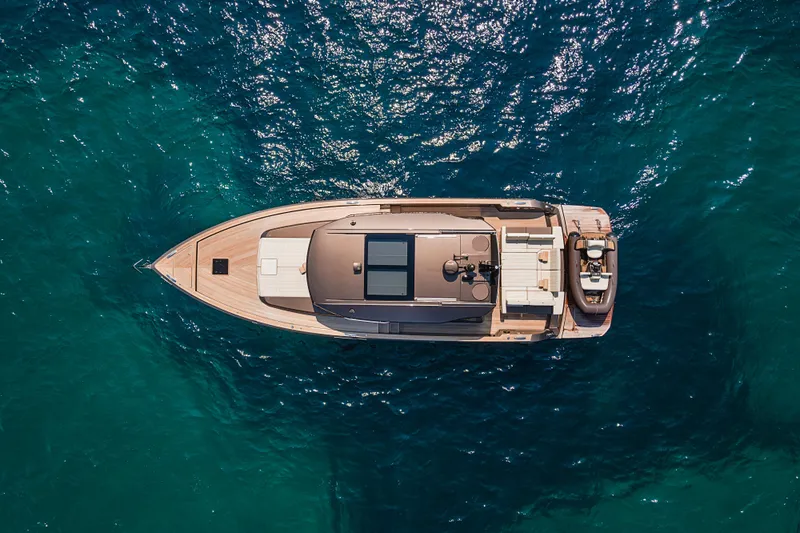 M/y Rubi Yacht Photos Pics Aerial view of 2024 Pardo Yachts GT52 cruising on blue ocean waters.
