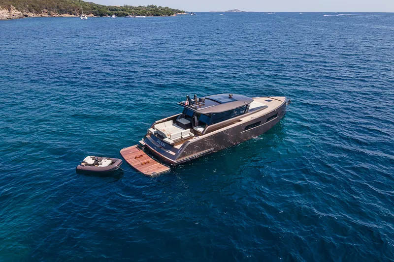 M/y Rubi Yacht Photos Pics 2024 Pardo Yachts GT52 luxury yacht cruising in clear blue waters.