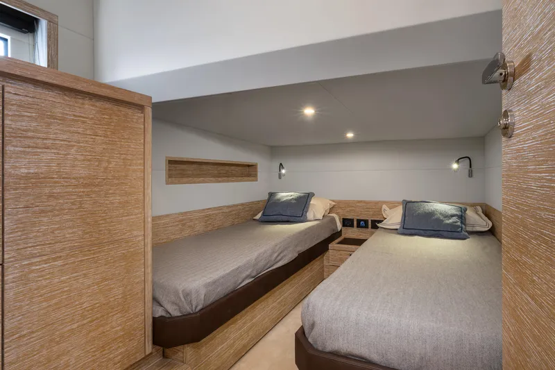 M/y Rubi Yacht Photos Pics 2024 Pardo Yachts GT52 cabin with twin beds, modern wood finish, and ambient lighting.