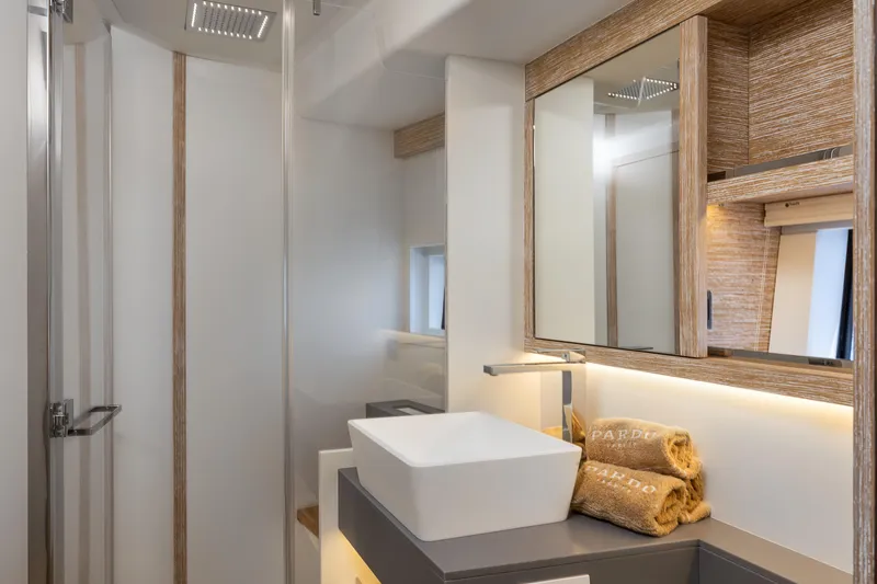 M/y Rubi Yacht Photos Pics Luxurious bathroom interior of 2024 Pardo Yachts GT52, featuring modern sink and elegant wood accents.