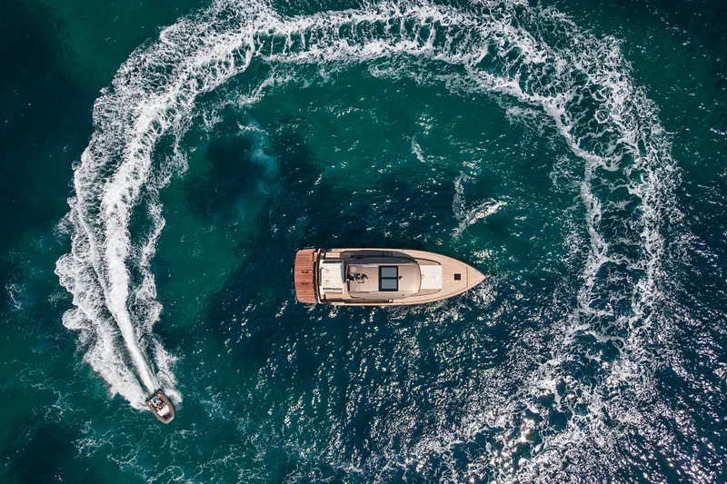 M/y Rubi Yacht Photos Pics Aerial view of 2024 Pardo Yachts GT52 surrounded by ocean waves.