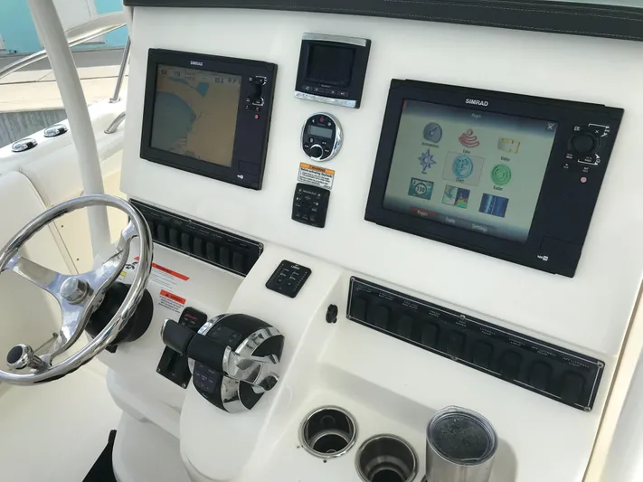 Endless Summer Yacht Photos Pics 2014 Boston Whaler 320 Outrage helm with advanced navigation systems.